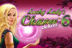 Play Lucky Ladys Charm Deluxe 6 slot with many talismans in the paytable.